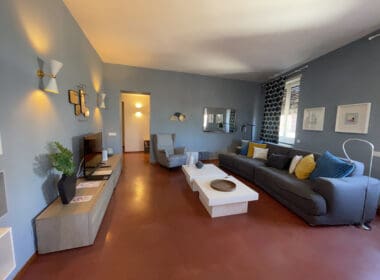 a living room with a couch and a tv