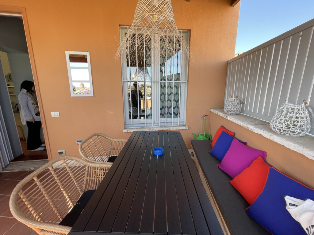 a table and chairs on a patio