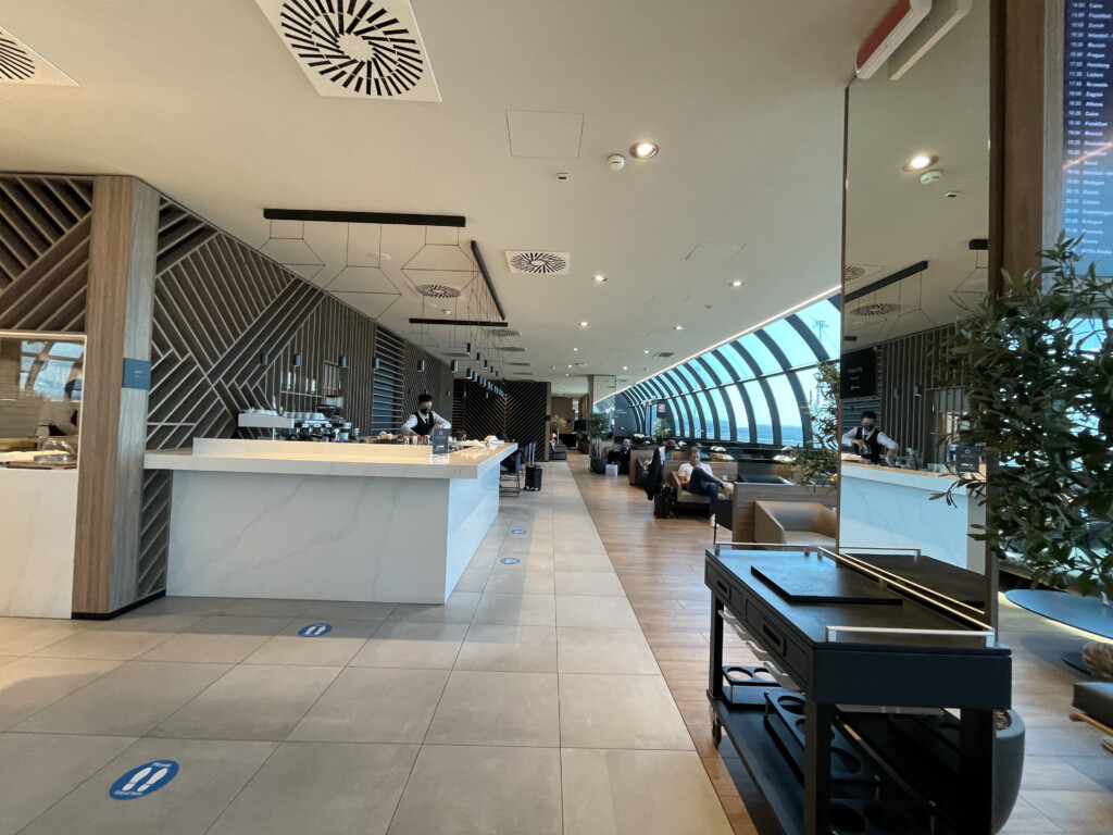 a room with a large white counter and a large window