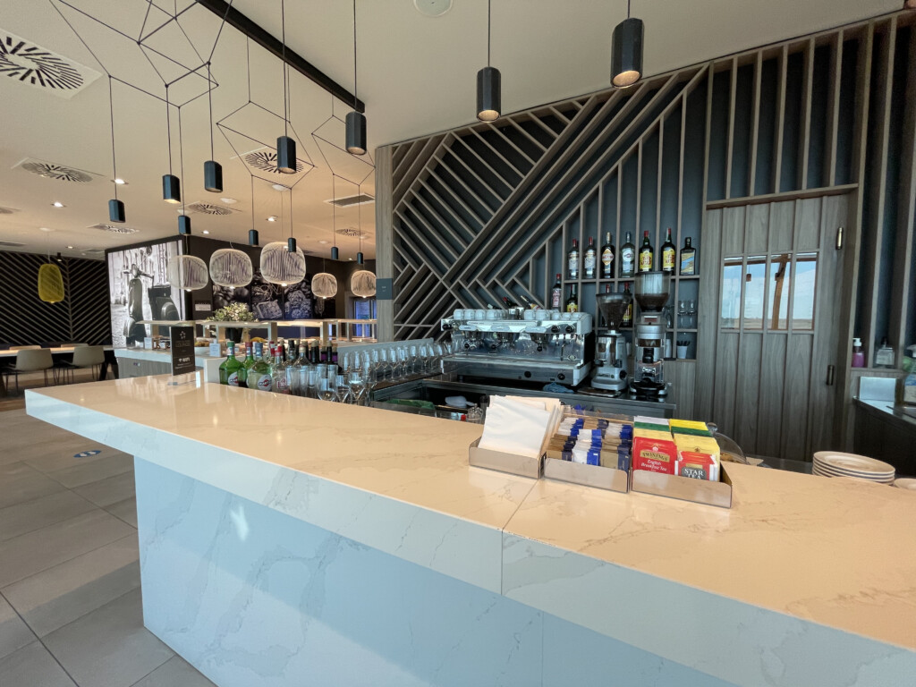 a counter with a bar and bottles of liquid