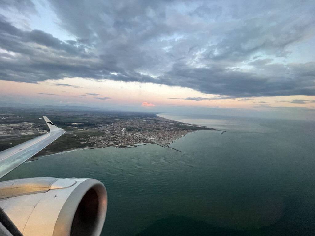 an airplane wing and wing of an airplane over water