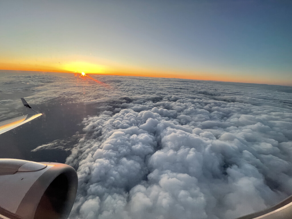 a view of the sun from an airplane window