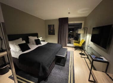 a bedroom with a bed and a television