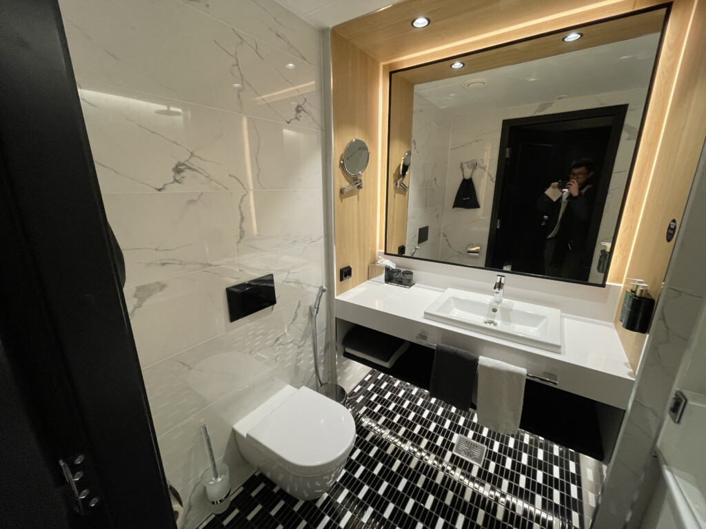 a bathroom with a mirror and sink