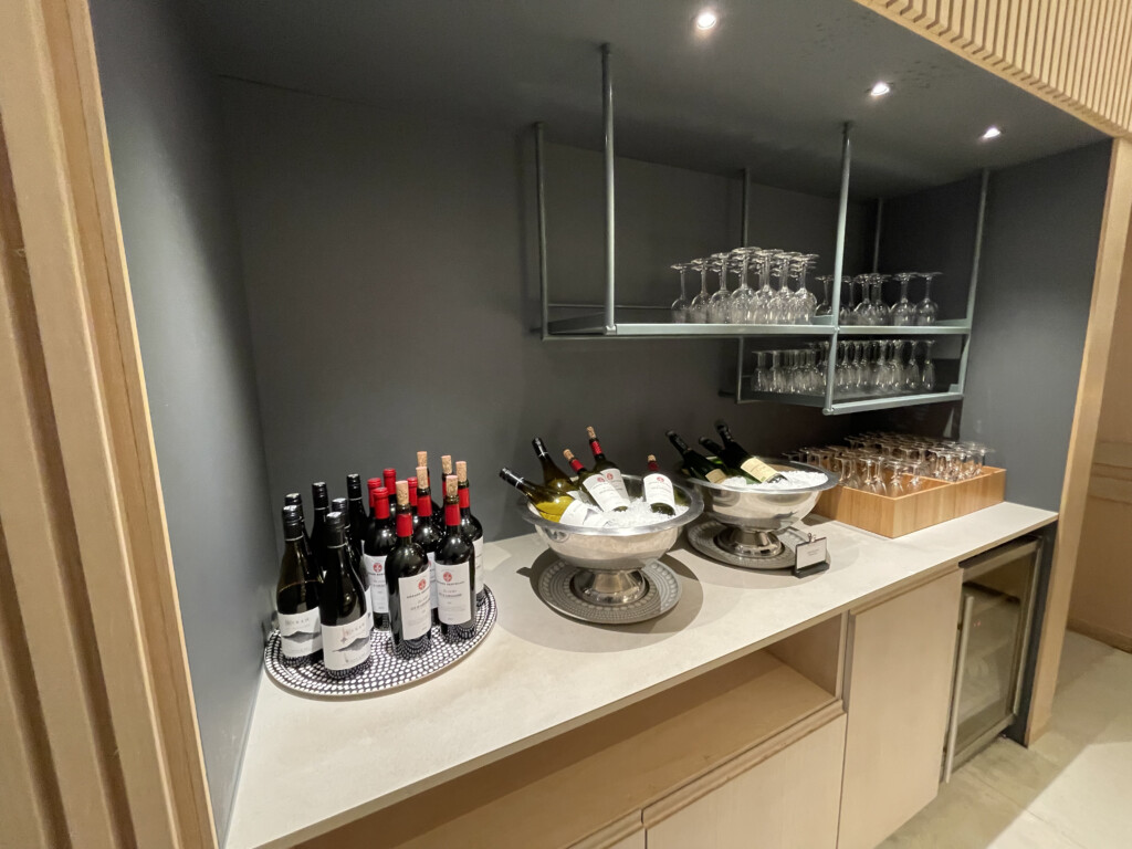 a wine bottles and glasses on a counter