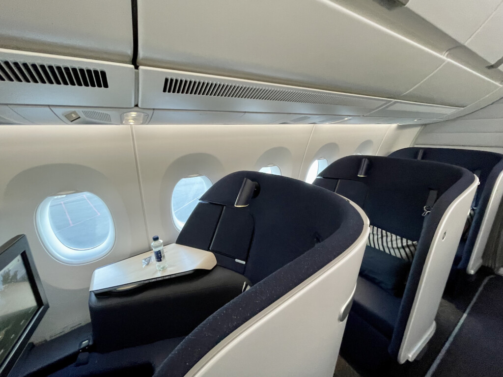 a table and chairs in an airplane