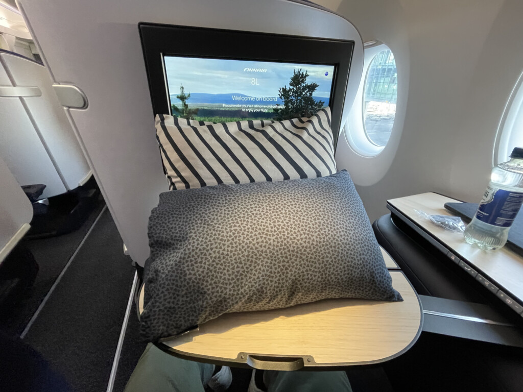 a pillow on a table in an airplane