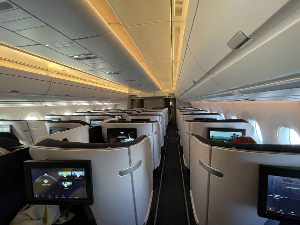 an airplane with seats and monitors