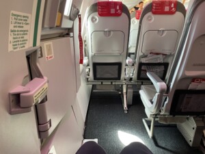 a plane with seats and a screen