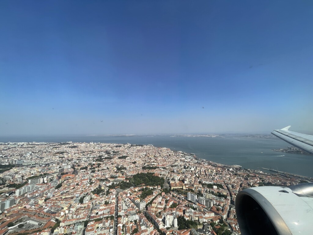 an aerial view of a city and water