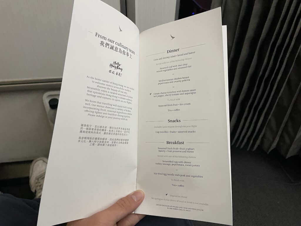 a hand holding a menu