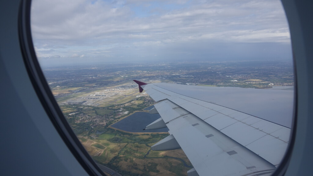 an airplane wing and a landscape