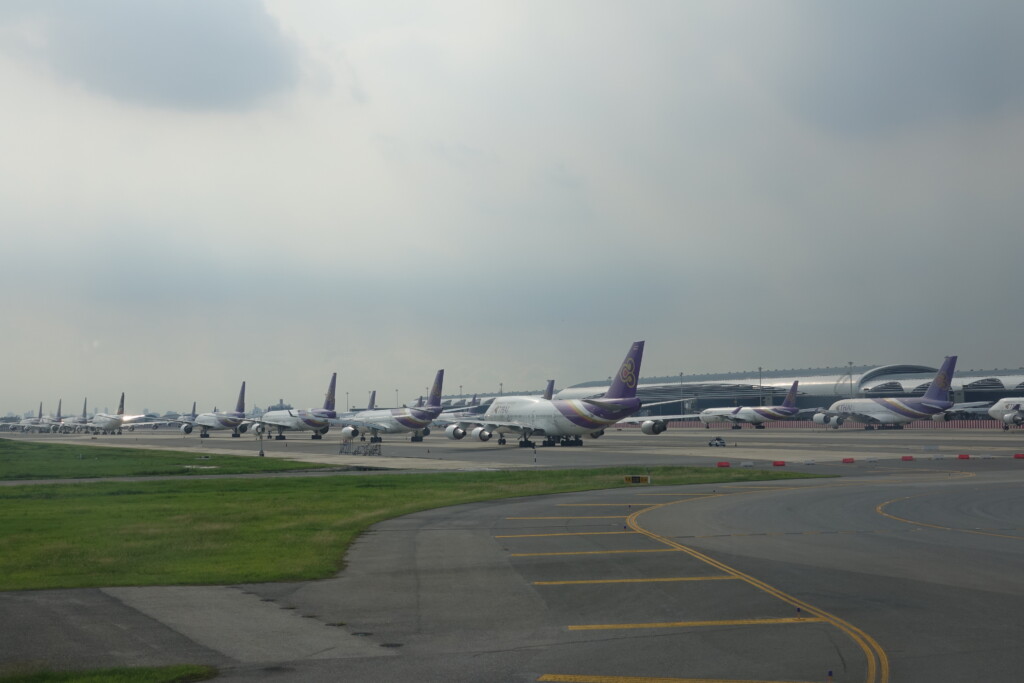 a group of airplanes on a runway