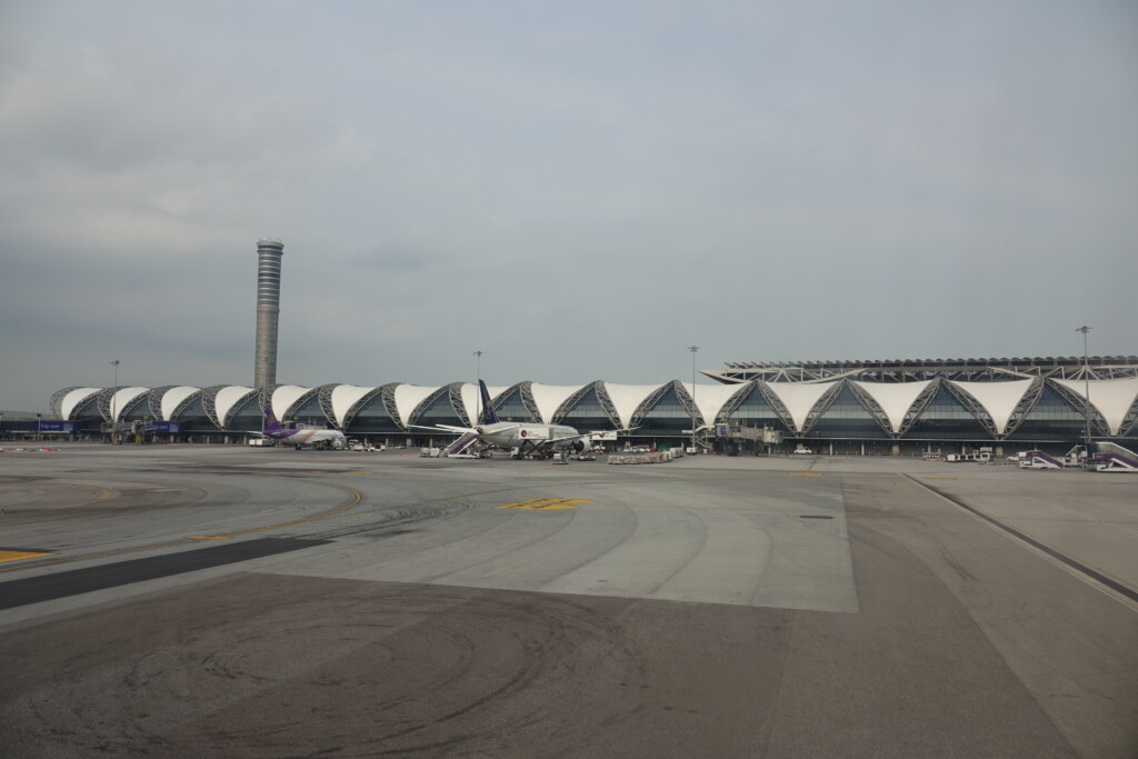 an airport with airplanes on the runway