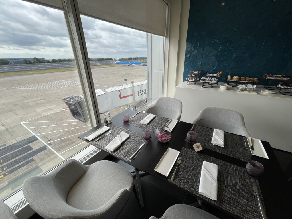 a table with chairs and a window