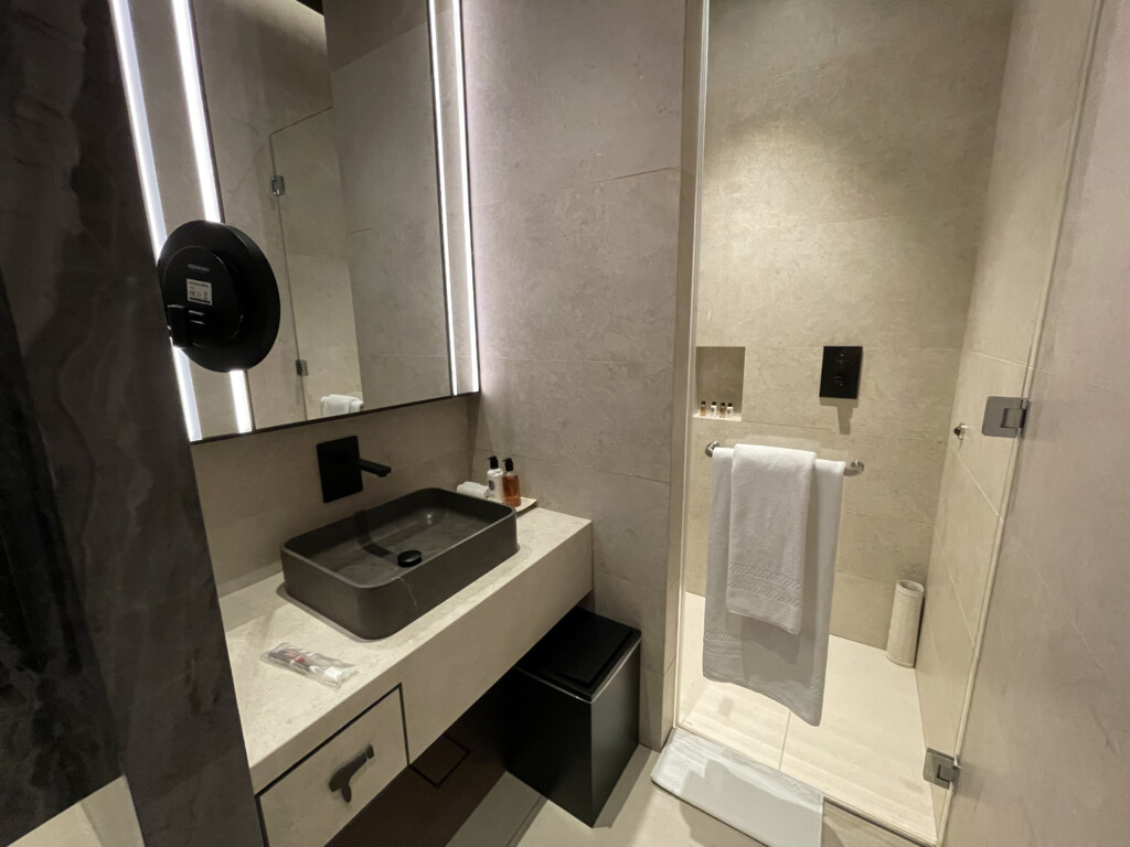 a bathroom with a mirror and sink