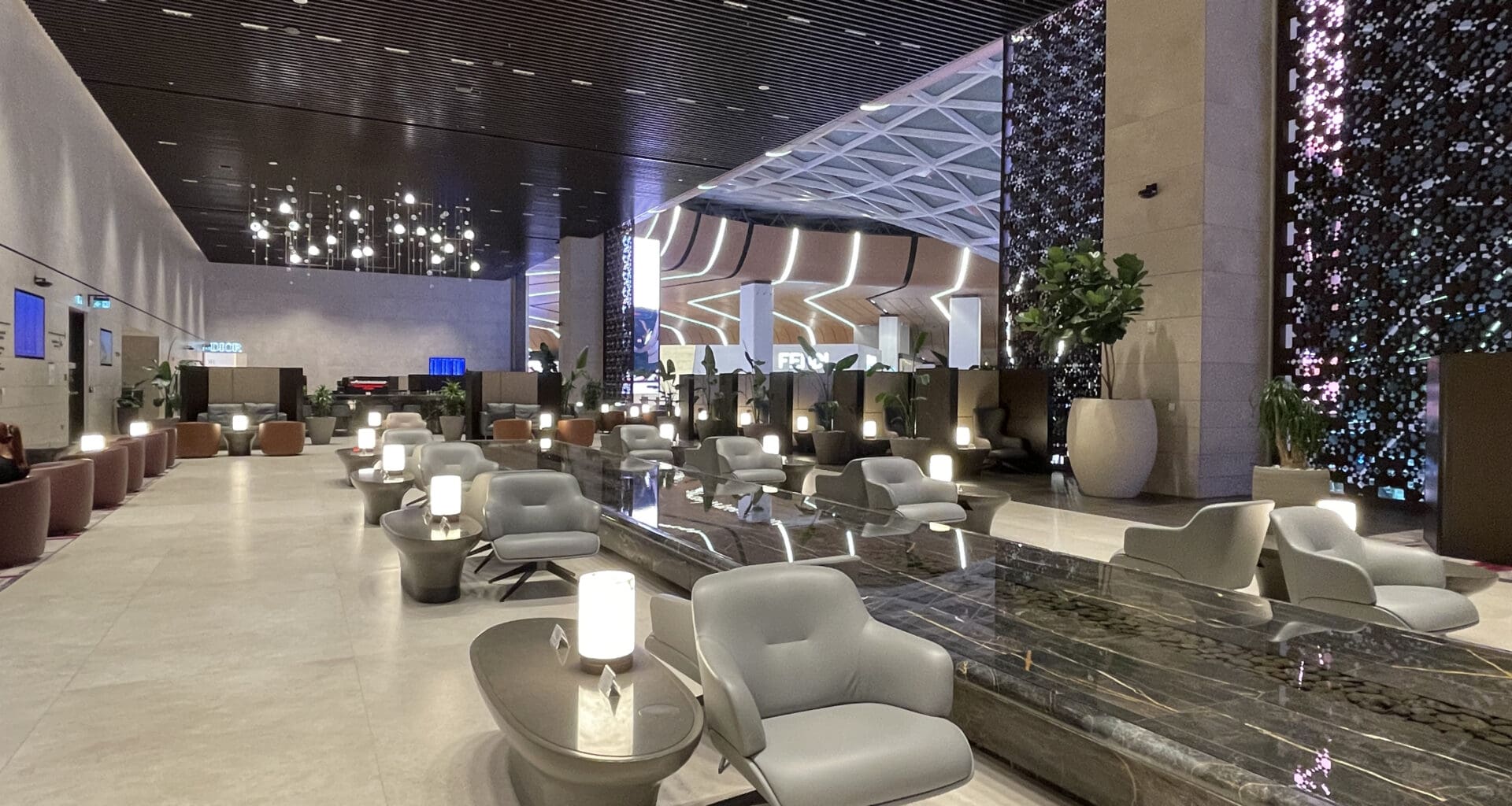 a lobby with chairs and tables