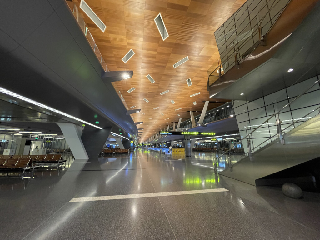 a large airport terminal with stairs and stairs