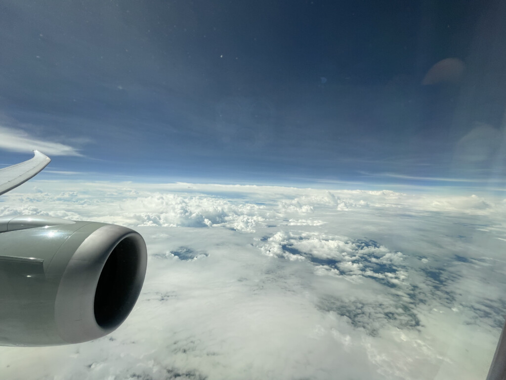 an airplane wing and clouds