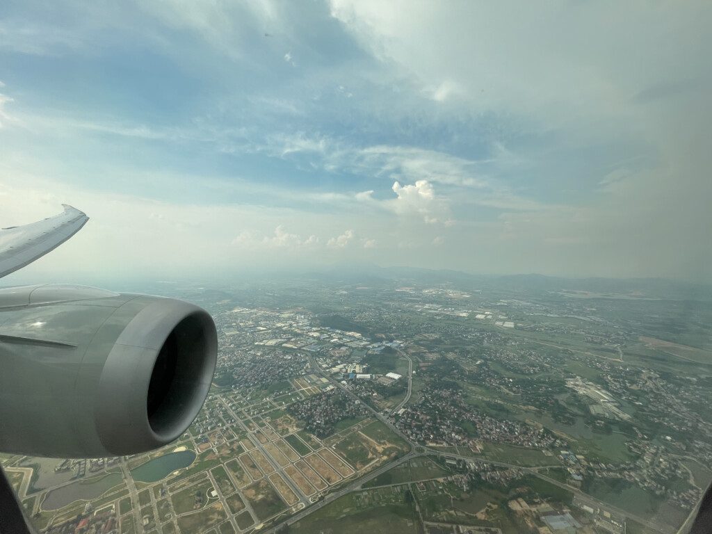 an airplane wing and a city