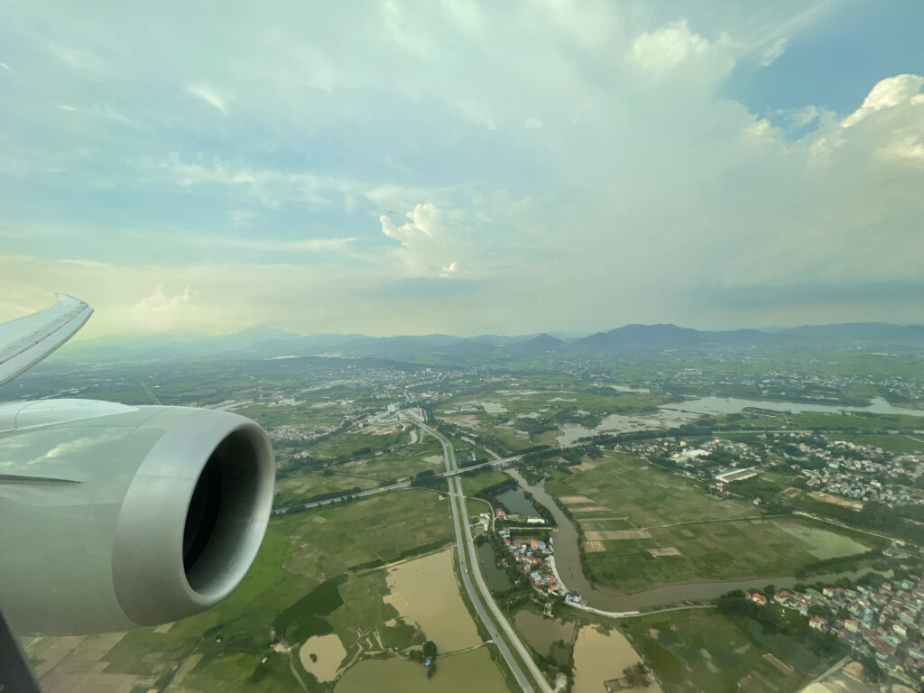 an airplane wing and a landscape