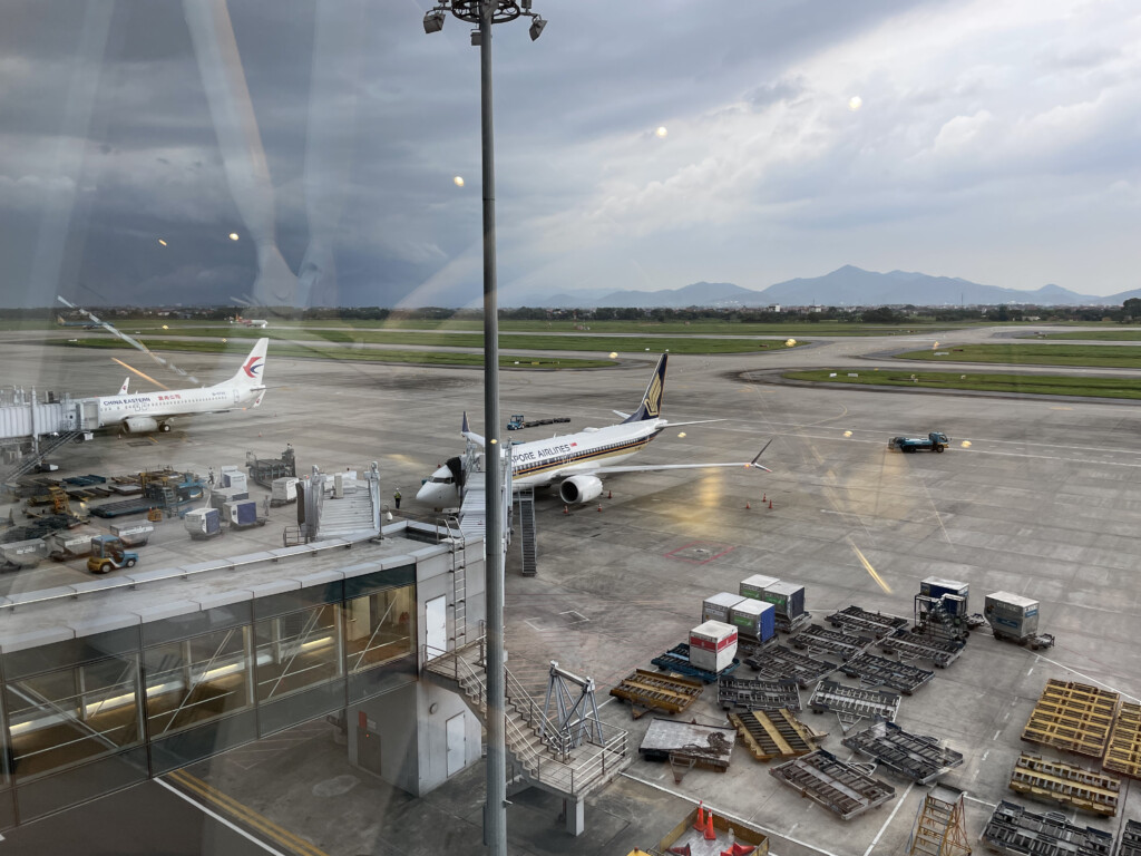 an airport with airplanes on the runway