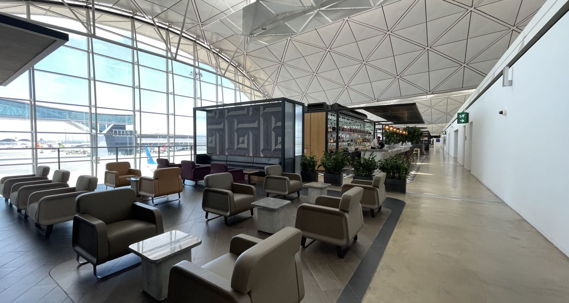 a lounge area with chairs and tables