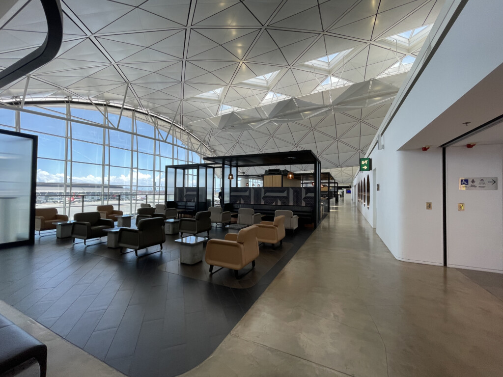 a room with chairs and a glass ceiling