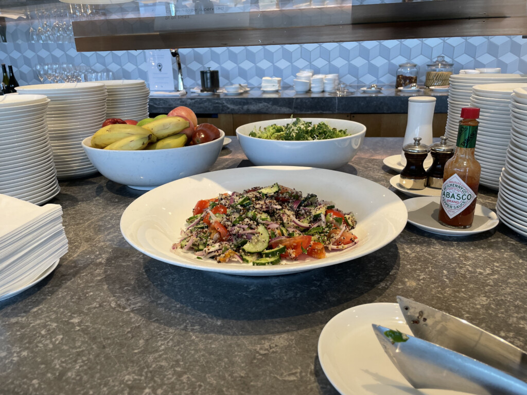 a bowl of salad and bowls of food