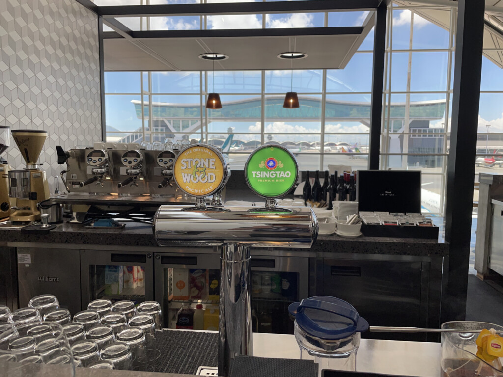 a bar with a counter and a few beer taps