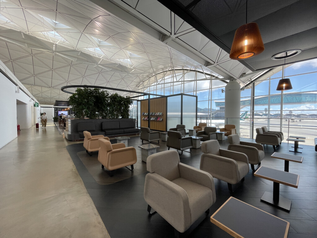 a lounge area with chairs and tables