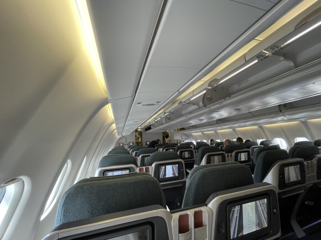 an airplane with seats and a television on the side