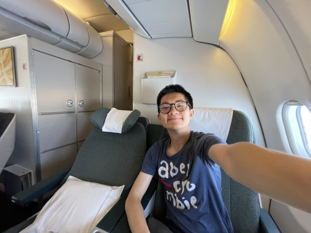 a man taking a selfie in an airplane