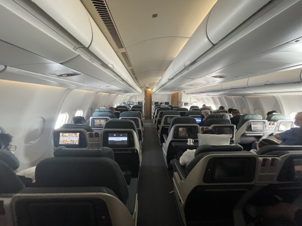 a plane with seats and people sitting on it