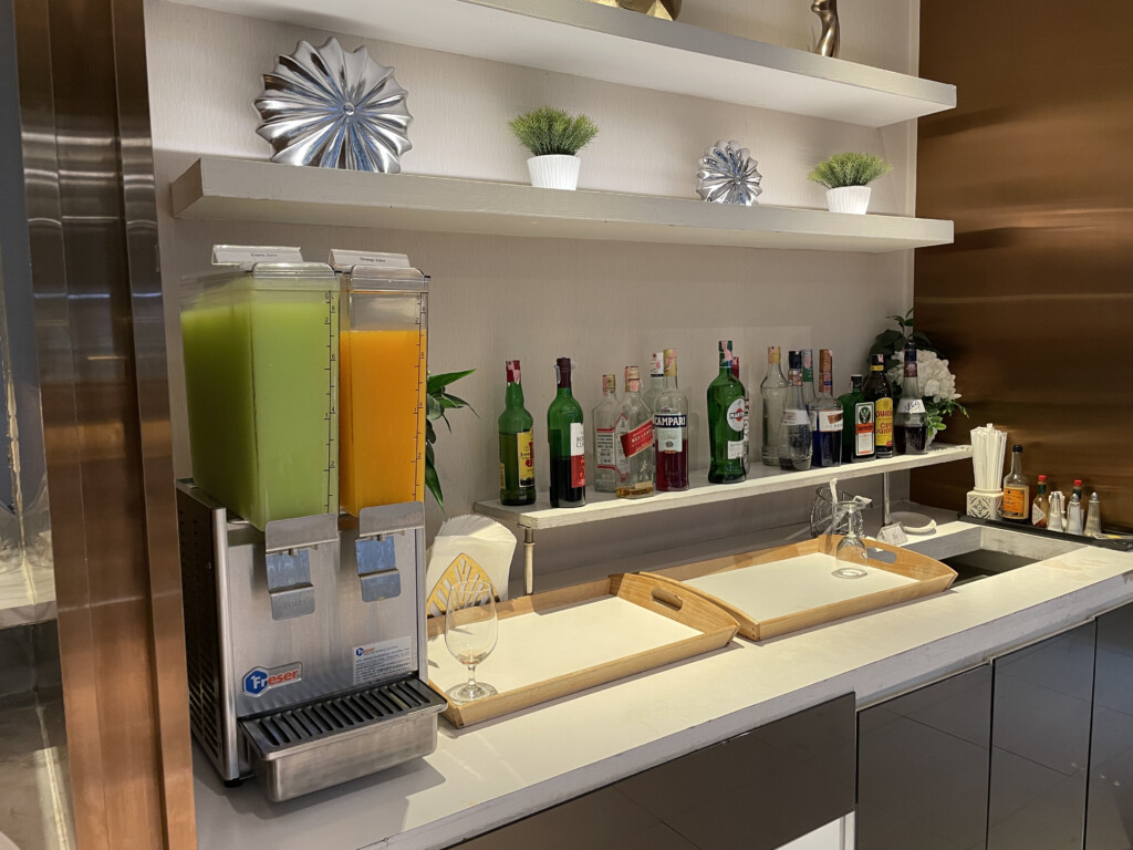 a bar with shelves and bottles of liquid