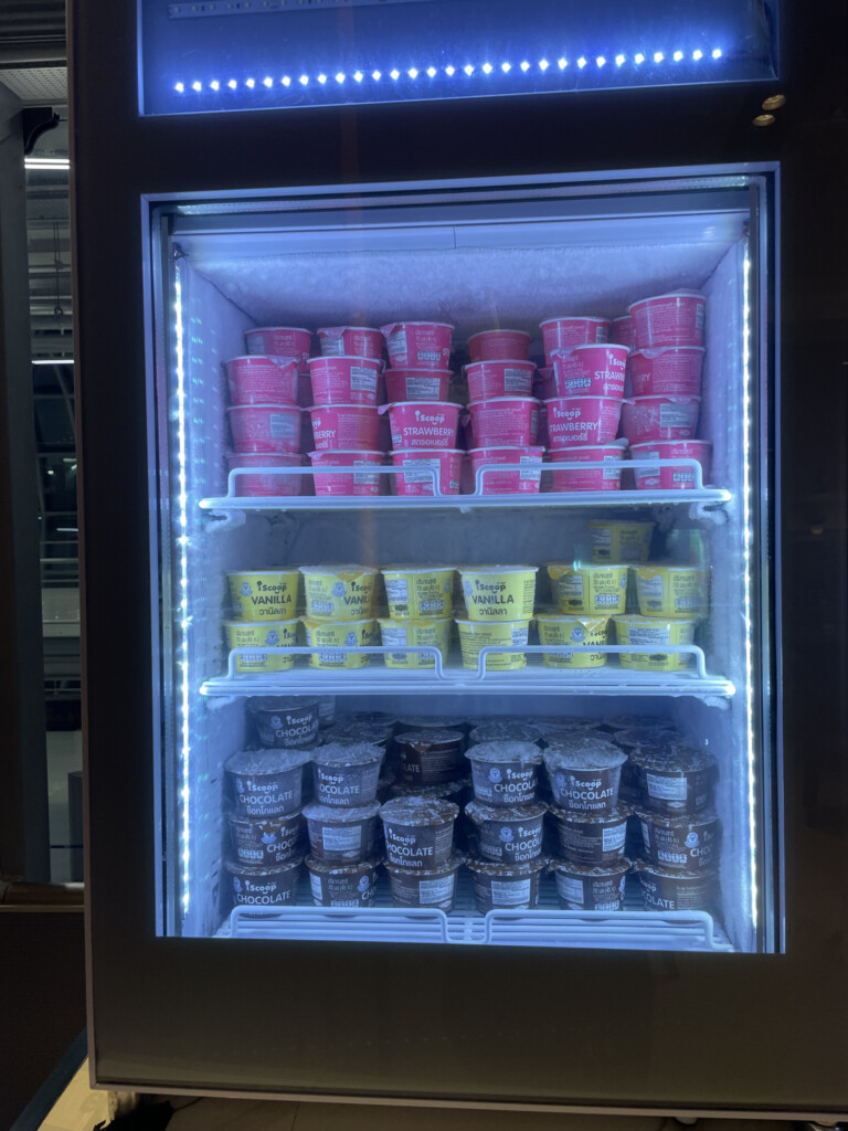 a refrigerator with ice cream containers