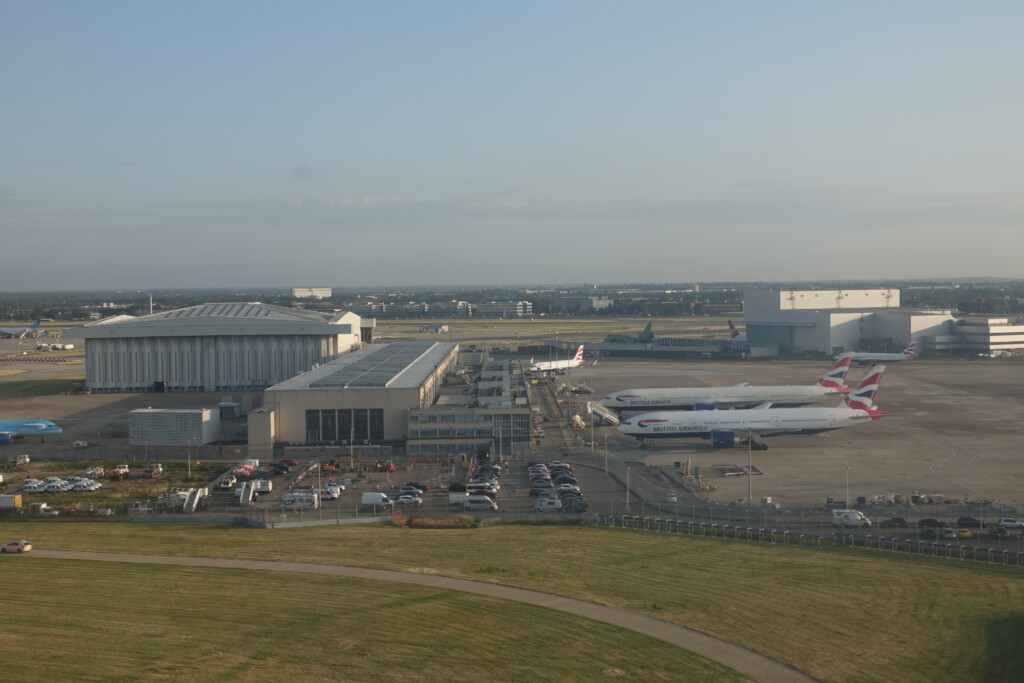 an airport with planes parked in the parking lot