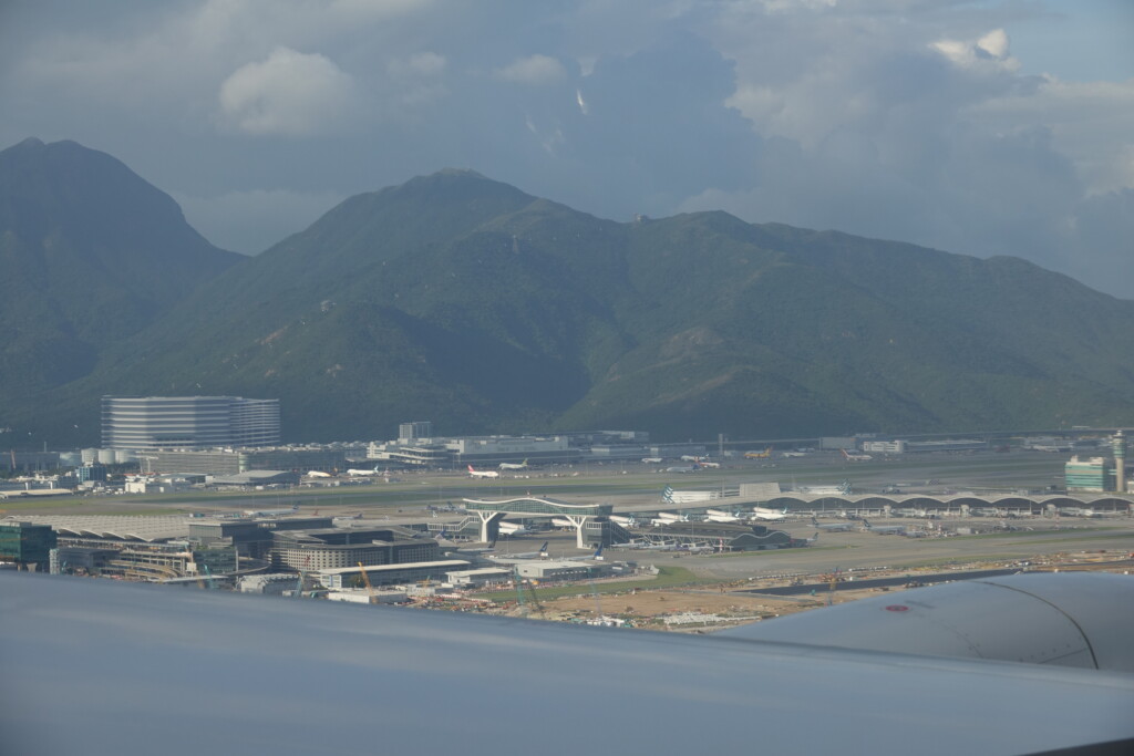 a view of a city and mountains from an airplane window