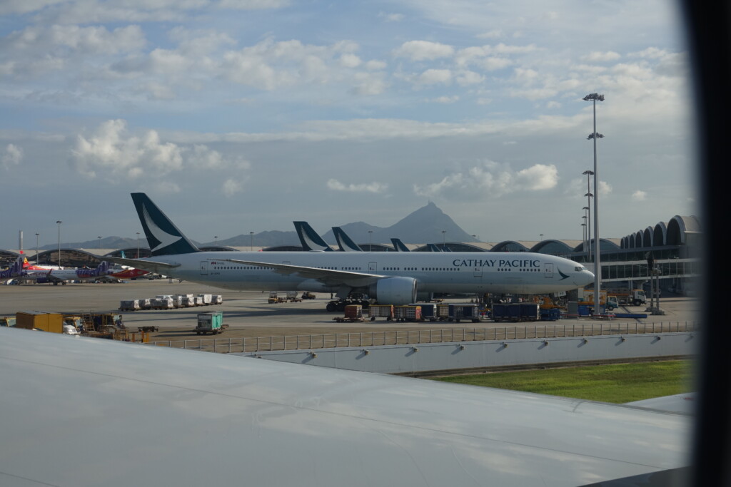 a group of airplanes at an airport