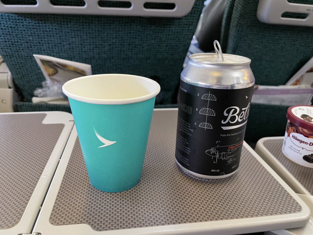 a blue cup and can on a table