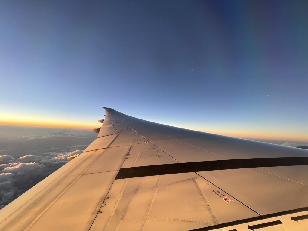 an airplane wing in the sky