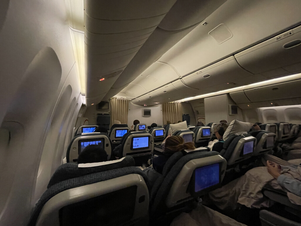 a group of people sitting in an airplane