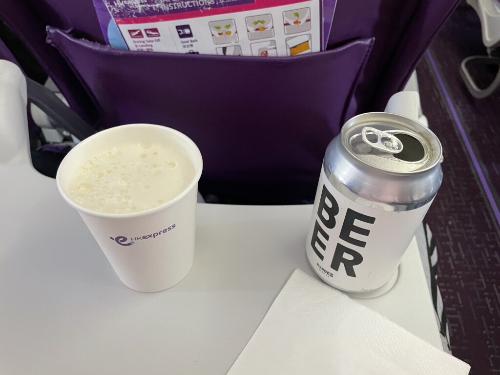 a beverage can and a cup on a table