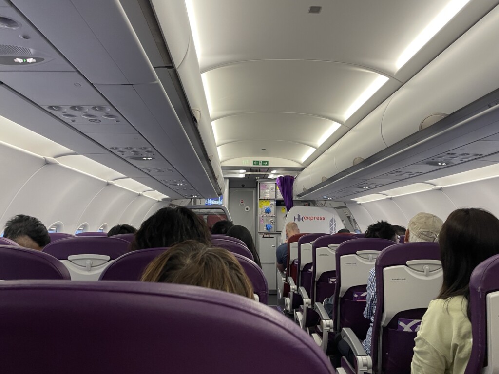 a group of people sitting in an airplane