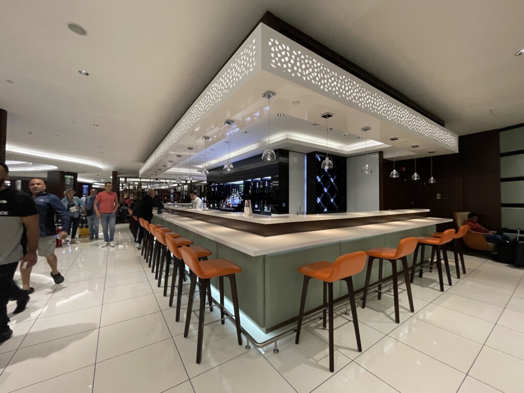 a bar with chairs and a counter