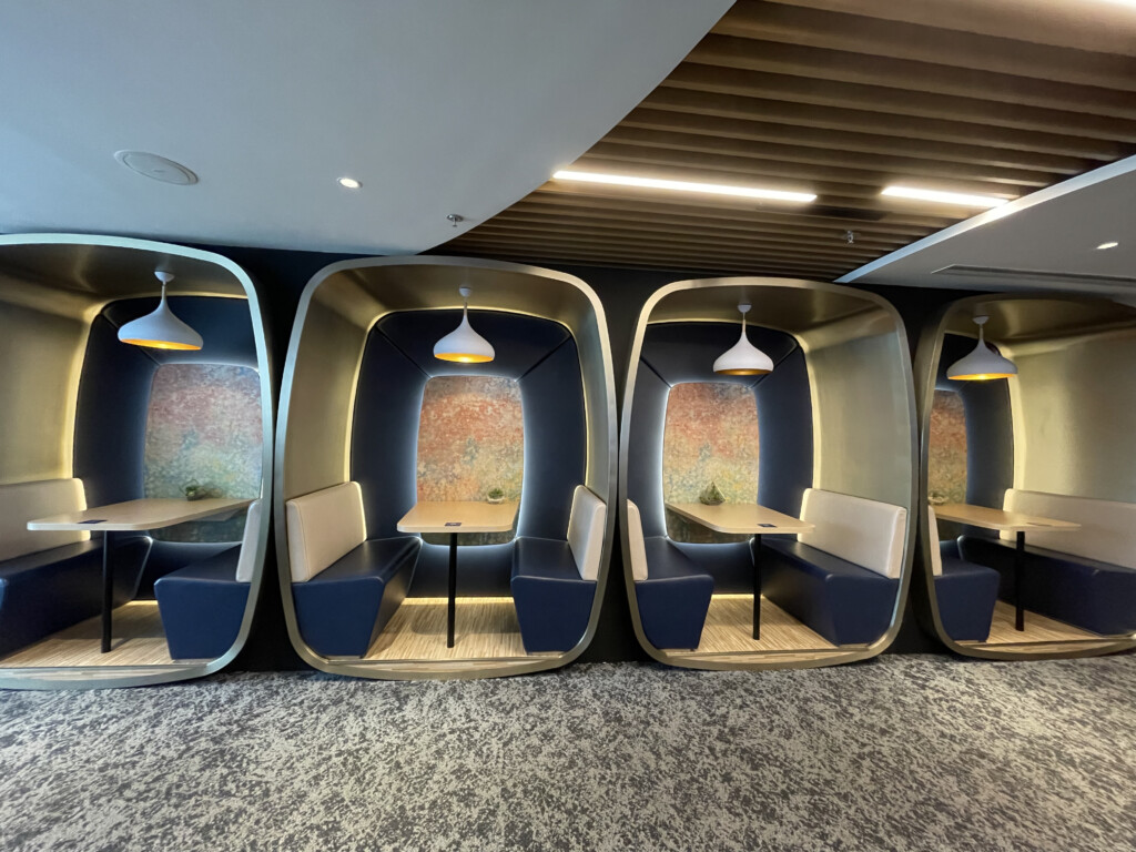 a group of tables and chairs in a room