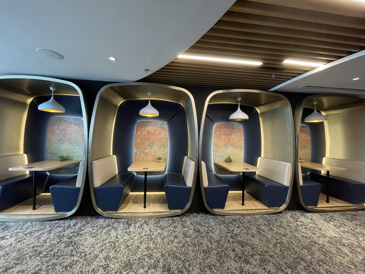 a group of tables and benches in a room