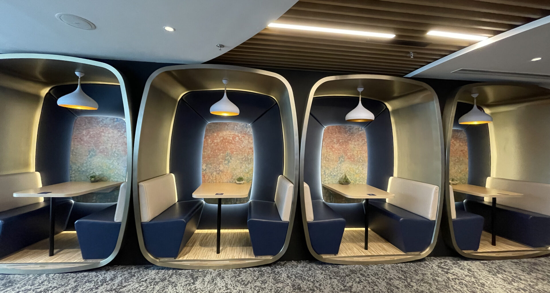 a group of tables and benches in a room