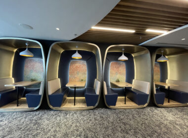 a group of tables and benches in a room
