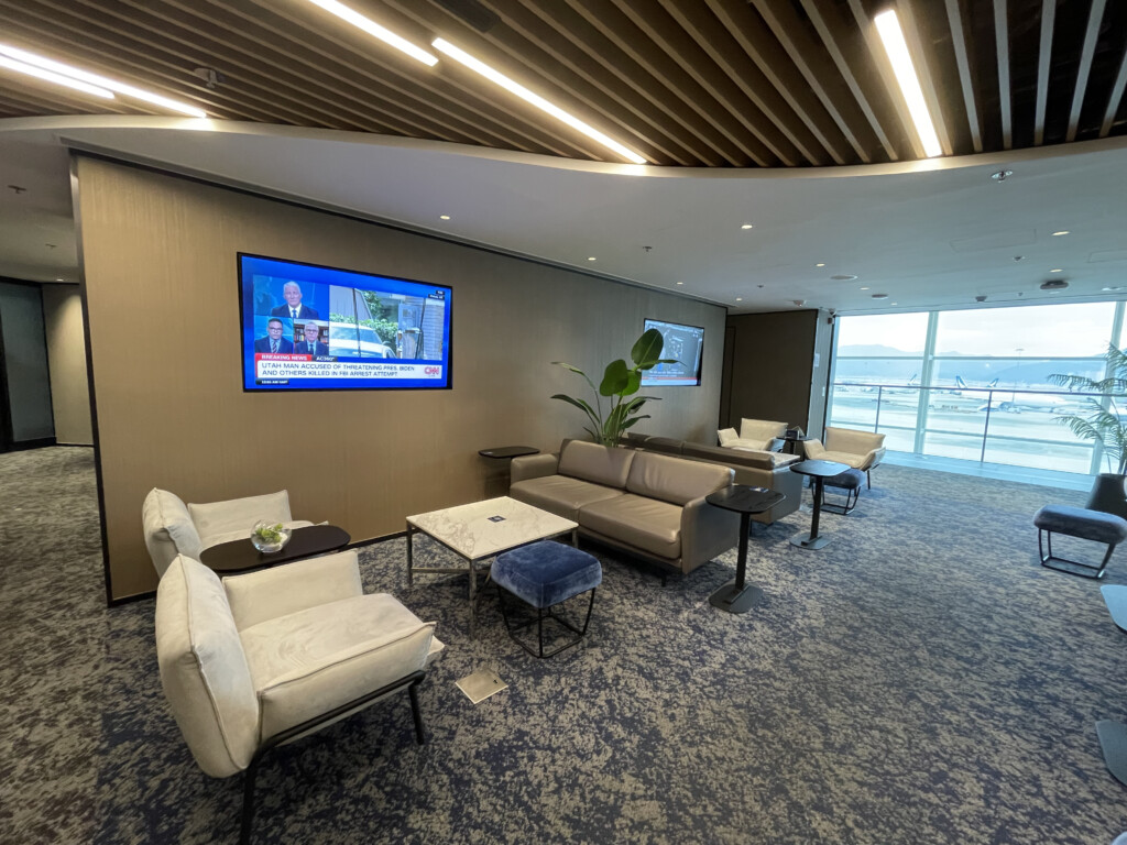 a room with couches and a television on the wall